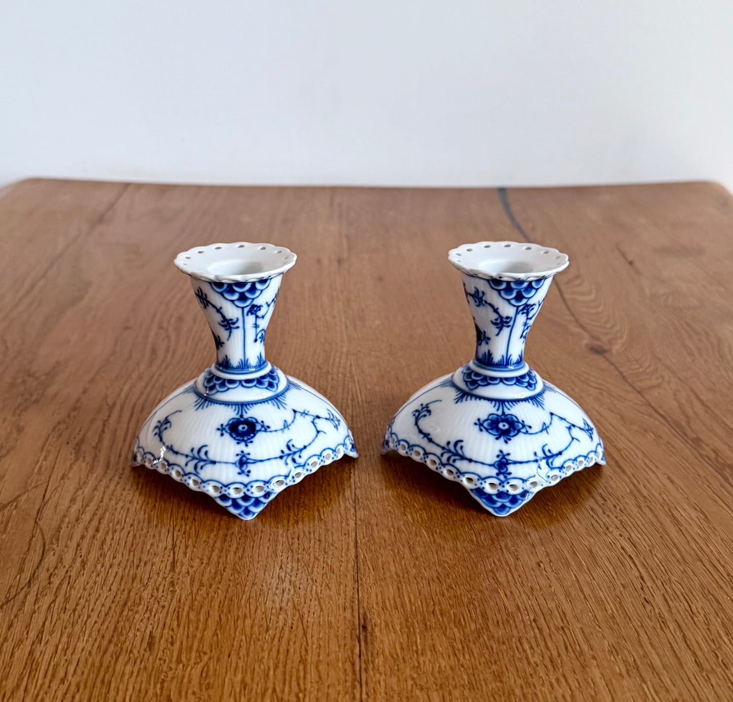 A set of two Royal Copenhagen Blue Fluted Full Lace candle sticks (#1038)